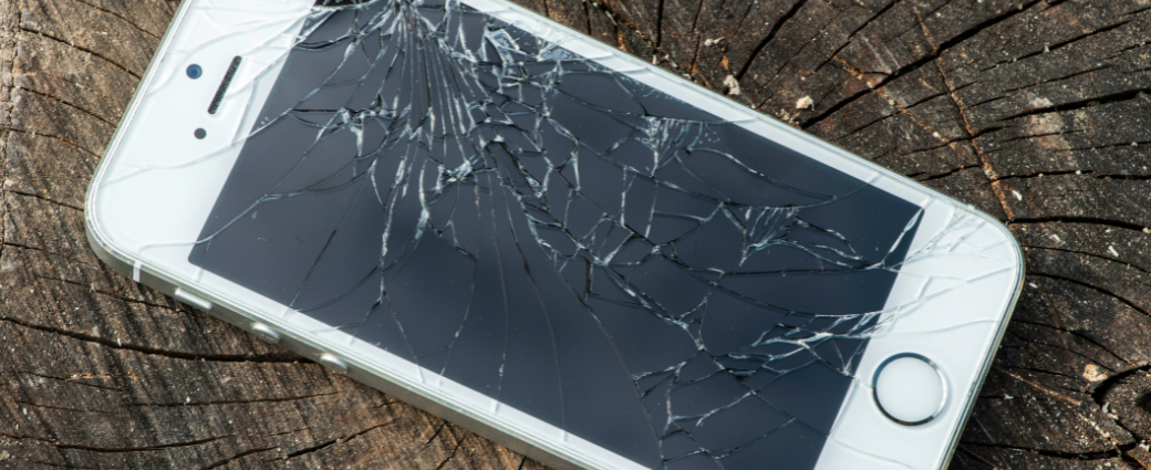 Shattered iPhone representing mistake cost in reverse logistics